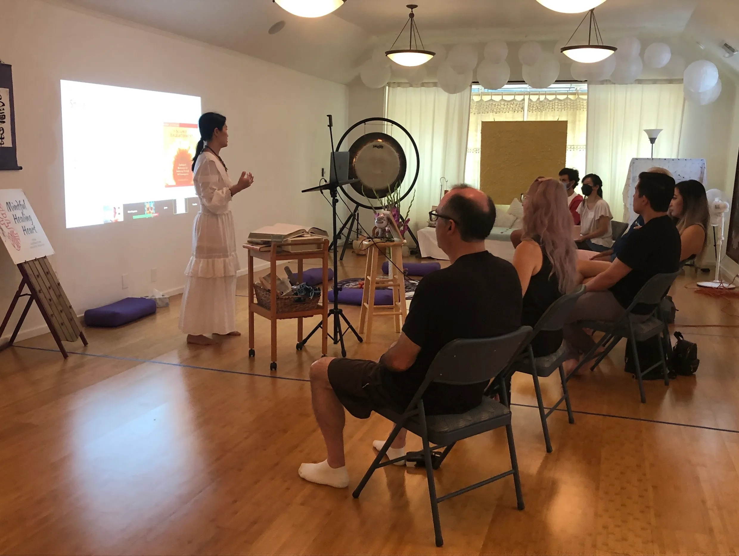 Mindful Healing Heart community healing session with singing bowls and group energy work